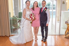 Liana and Franky - and their officiant!
